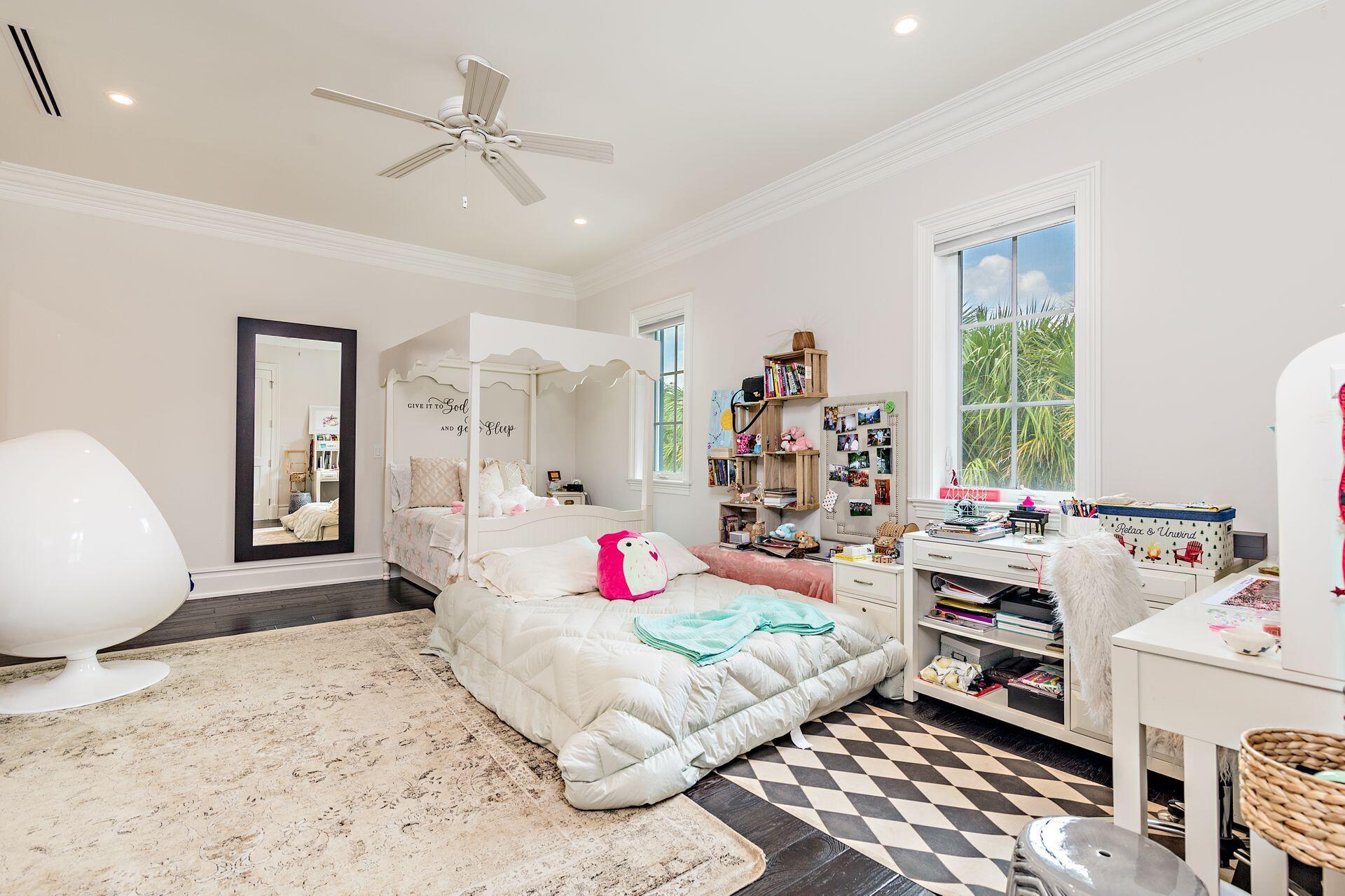 1222 North Ocean Boulevard Gulf Stream, FL 33483 - Photo 22 of 61 a bedroom with a bed and a chandelier