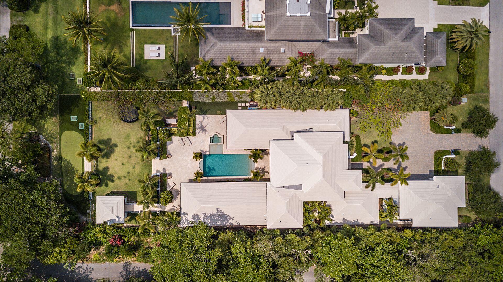 1222 North Ocean Boulevard Gulf Stream, FL 33483 - Photo 38 of 61 an aerial view of a house with a yard and large trees