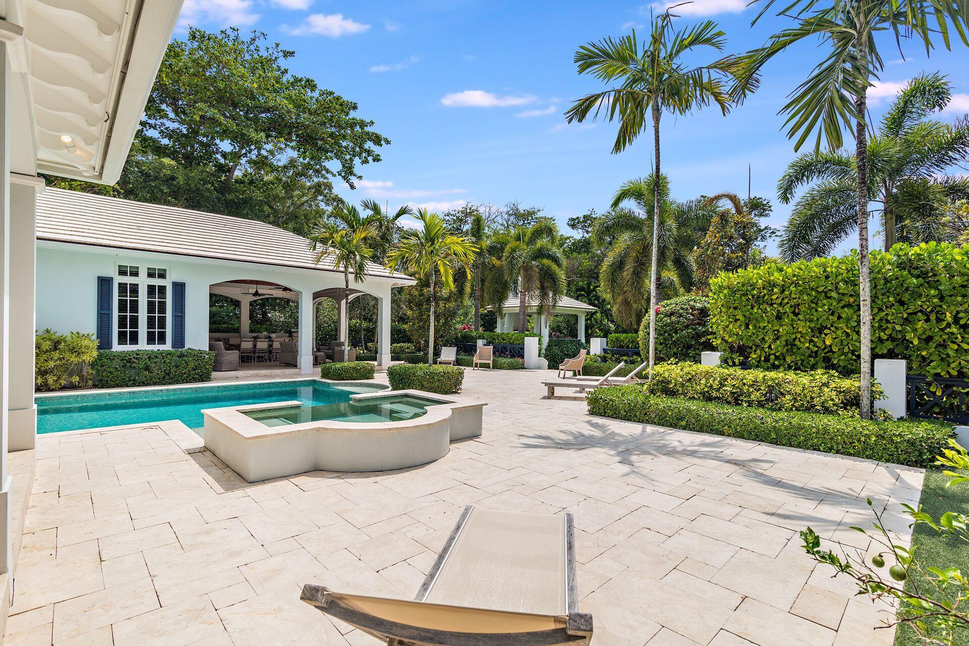 1222 North Ocean Boulevard Gulf Stream, FL 33483 - Photo 46 of 61 a view of a backyard with plants and palm tree