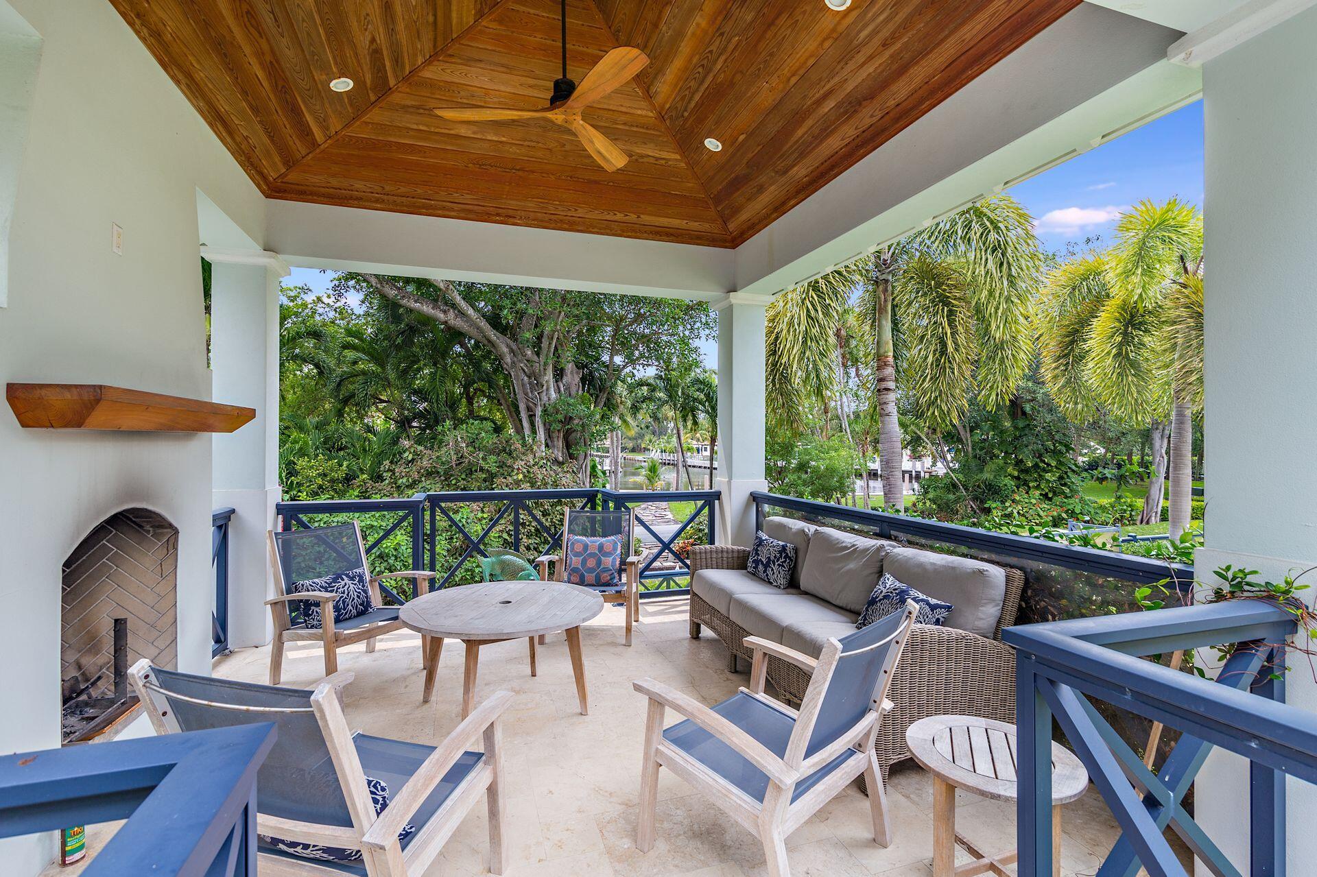 1222 North Ocean Boulevard Gulf Stream, FL 33483 - Photo 54 of 61 a view of a patio with a dining table and chairs