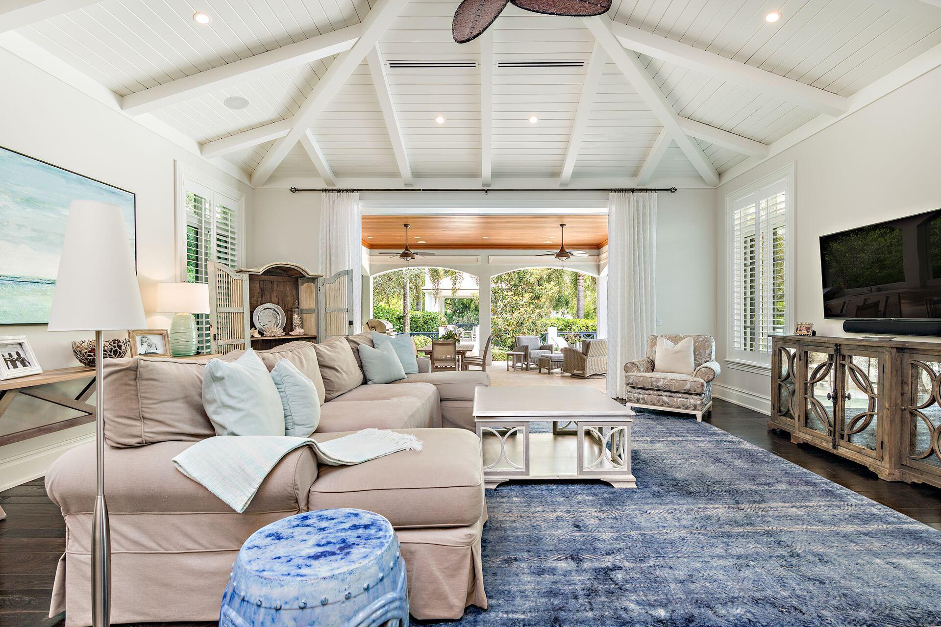 1222 North Ocean Boulevard Gulf Stream, FL 33483 - Photo 9 of 61 a living room with furniture and a flat screen tv