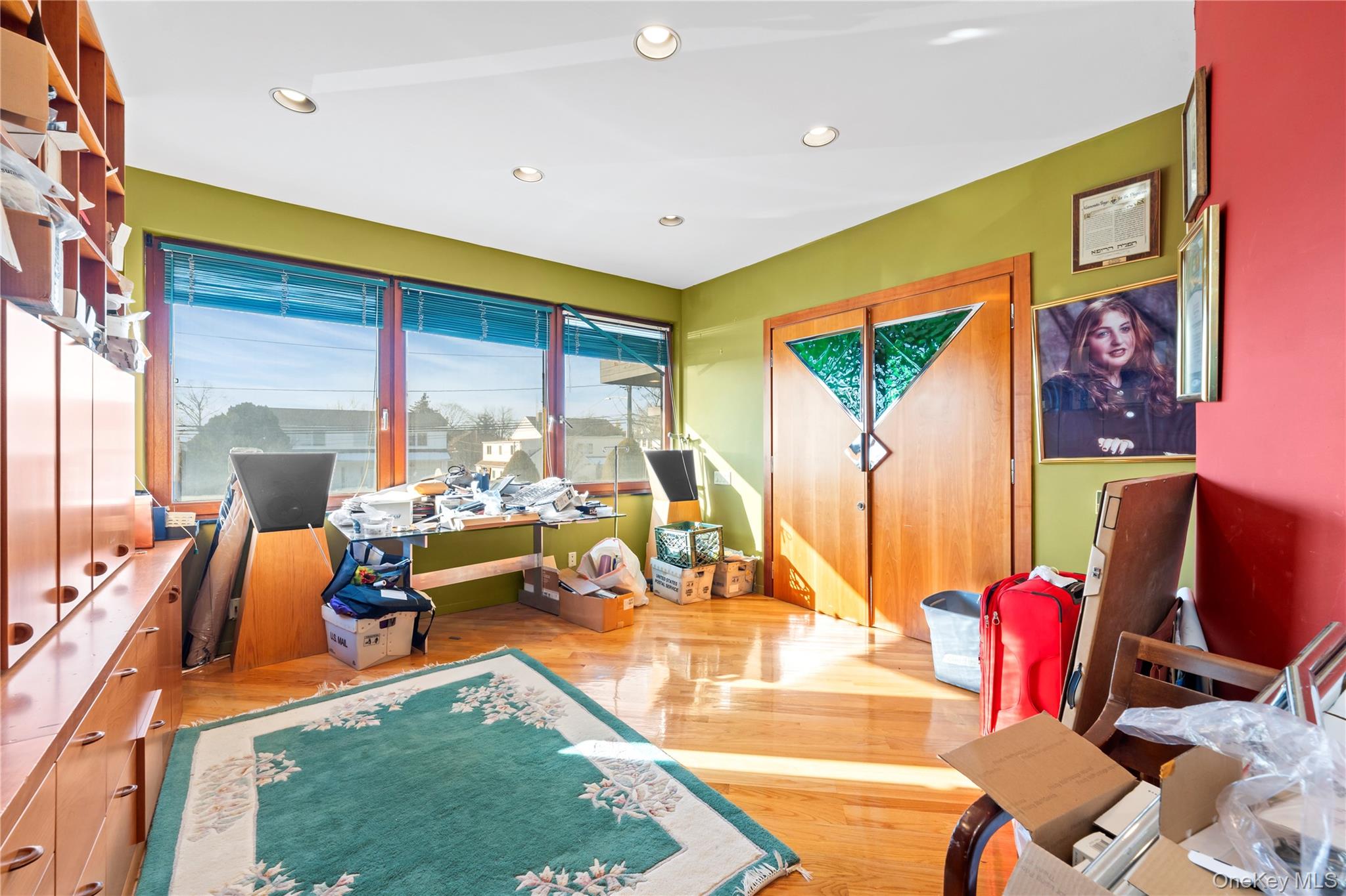 2829 Frankel Boulevard Merrick, NY 11566 - Photo 16 of 46 a living room with furniture flat screen tv and a large window