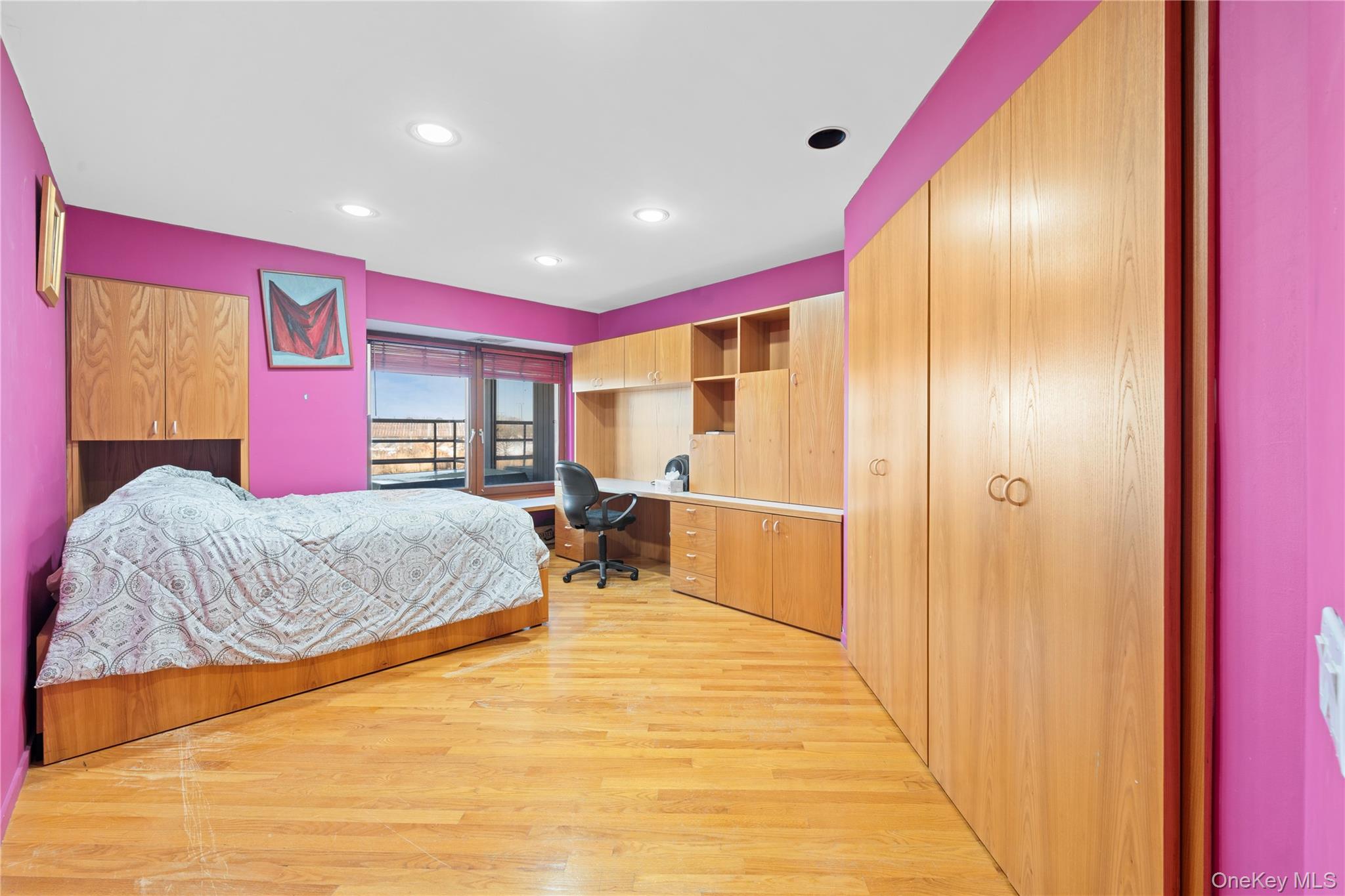 2829 Frankel Boulevard Merrick, NY 11566 - Photo 22 of 46 a bedroom with a bed and dresser with mirror