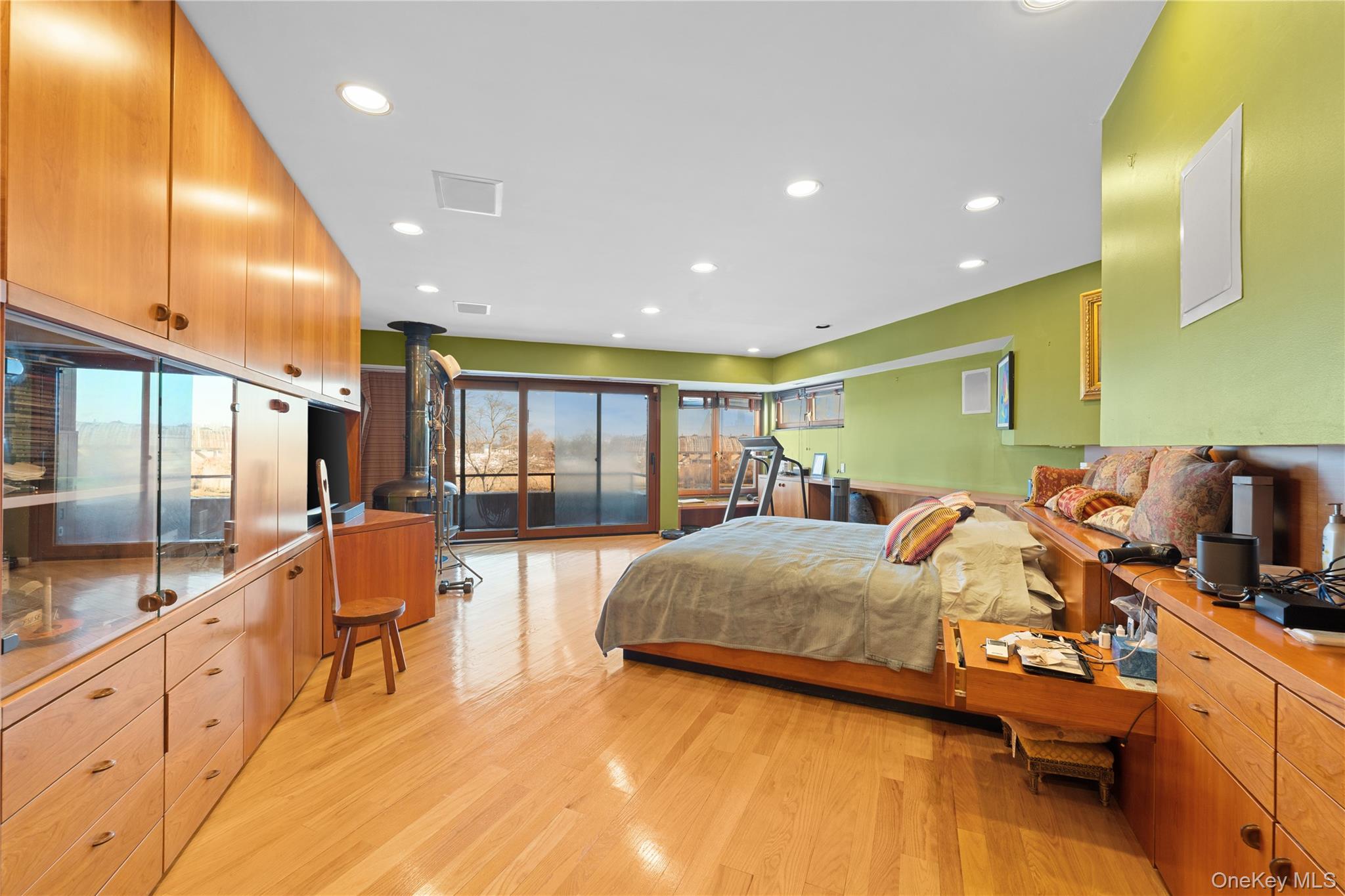 2829 Frankel Boulevard Merrick, NY 11566 - Photo 26 of 46 a spacious bedroom with a bed and large windows