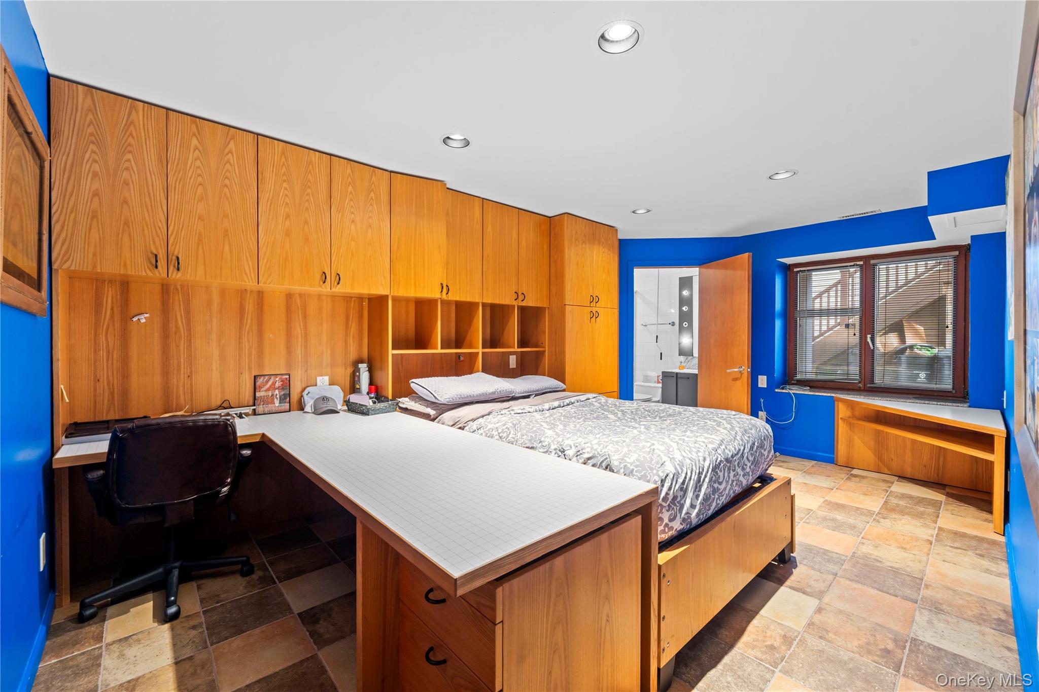 2829 Frankel Boulevard Merrick, NY 11566 - Photo 33 of 46 a bed room with a bed and a table