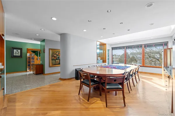 a view of a dining room with furniture window and wooden floor