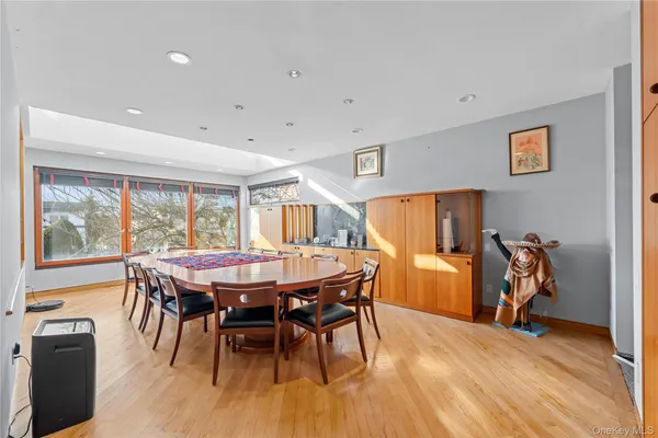 a dining room with a table and chairs