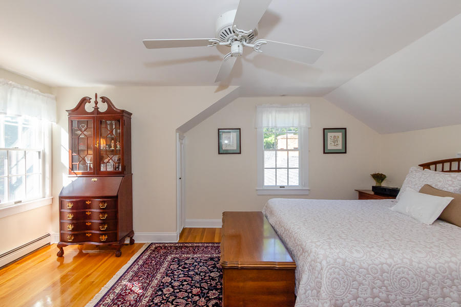 18 Register Road Marion, MA 02738 - Photo 17 of 30 a bedroom with a bed dresser and a window