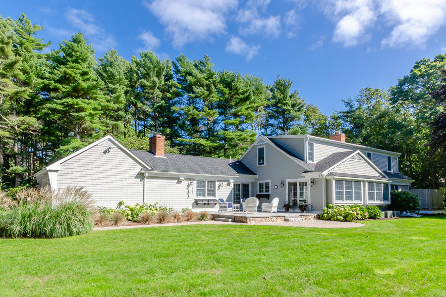 18 Register Road Marion, MA 02738 - Photo 3 of 30 a front view of a house with a garden and porch