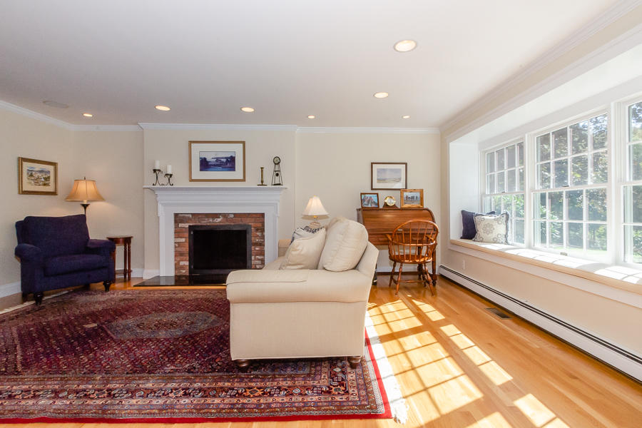 18 Register Road Marion, MA 02738 - Photo 9 of 30 a living room with furniture a large window and a fireplace