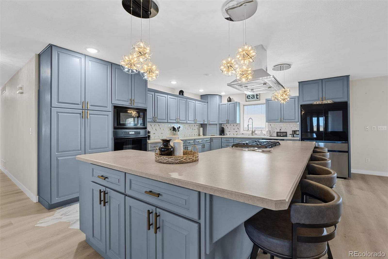 5330 Kiowa-Bennett Road Bennett, CO 80102 - Photo 11 of 50 a view of kitchen and kitchen island