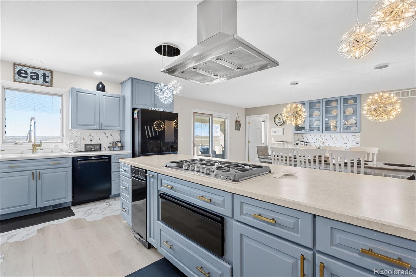 5330 Kiowa-Bennett Road Bennett, CO 80102 - Photo 13 of 50 a kitchen with stainless steel appliances granite countertop a stove and a sink