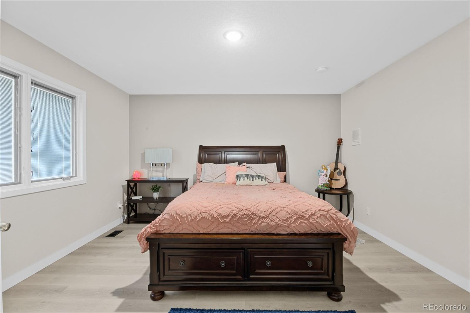5330 Kiowa-Bennett Road Bennett, CO 80102 - Photo 20 of 50 a bedroom with a bed and a window