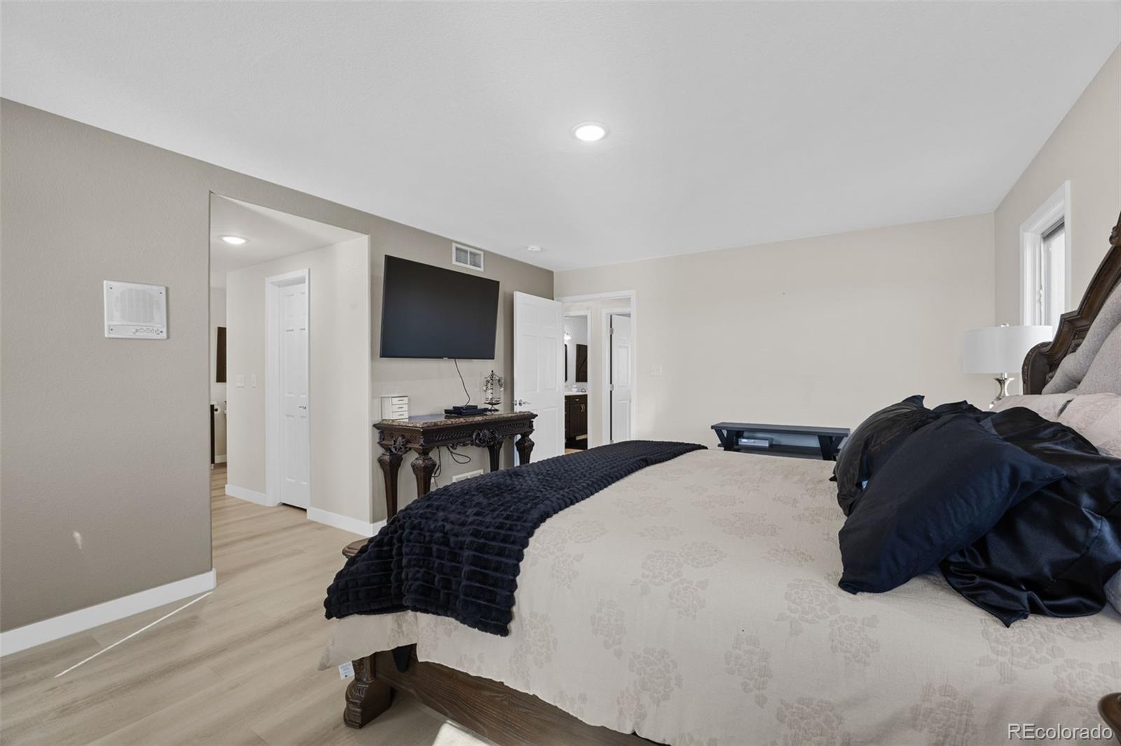 5330 Kiowa-Bennett Road Bennett, CO 80102 - Photo 23 of 50 a bedroom with a bed window and a television
