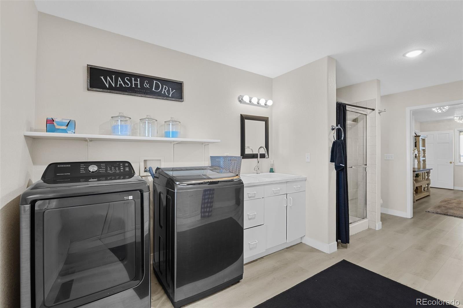 5330 Kiowa-Bennett Road Bennett, CO 80102 - Photo 30 of 50 a kitchen with a stove and a refrigerator