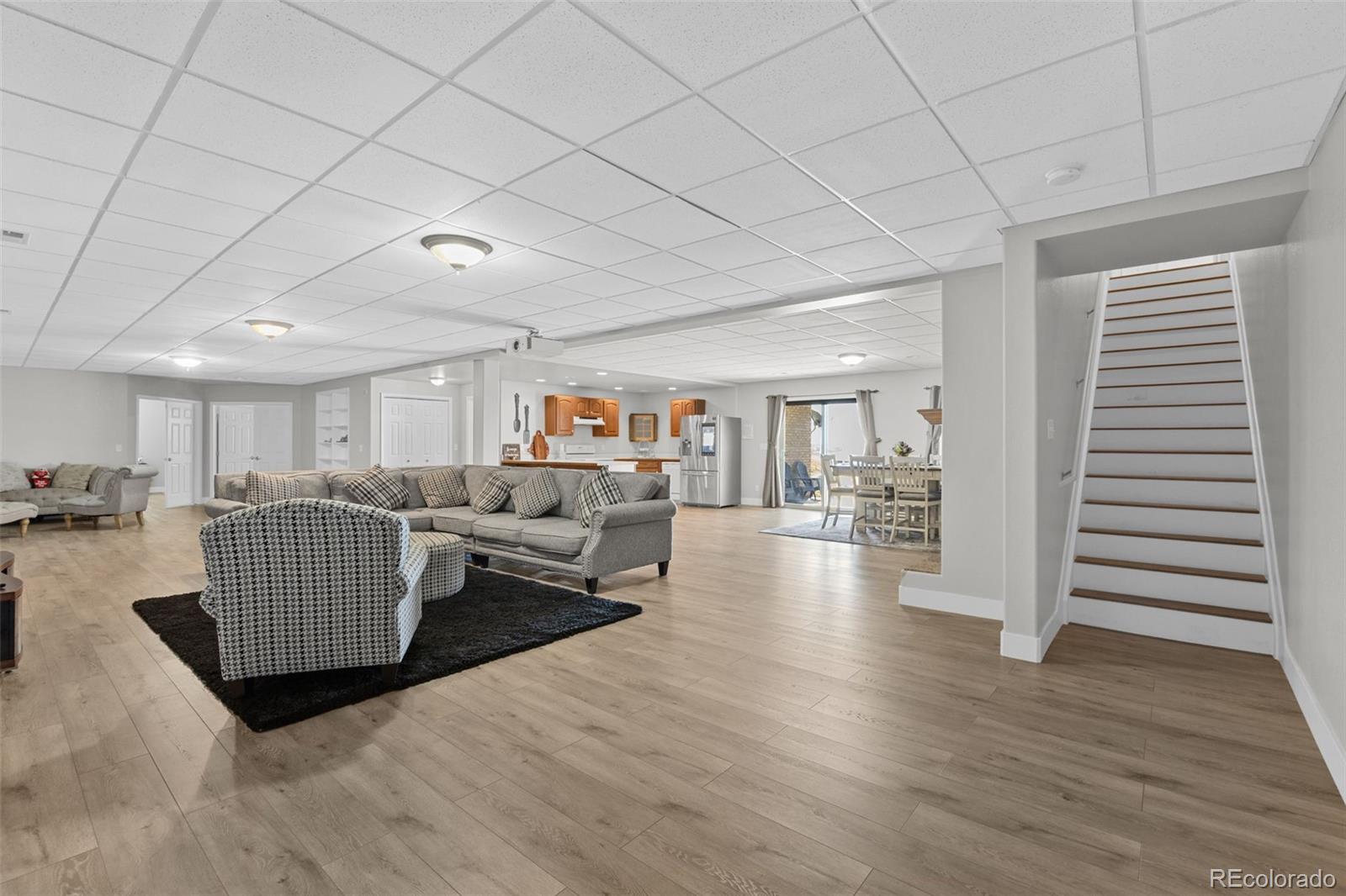 5330 Kiowa-Bennett Road Bennett, CO 80102 - Photo 34 of 50 a living room with furniture and a wooden floor