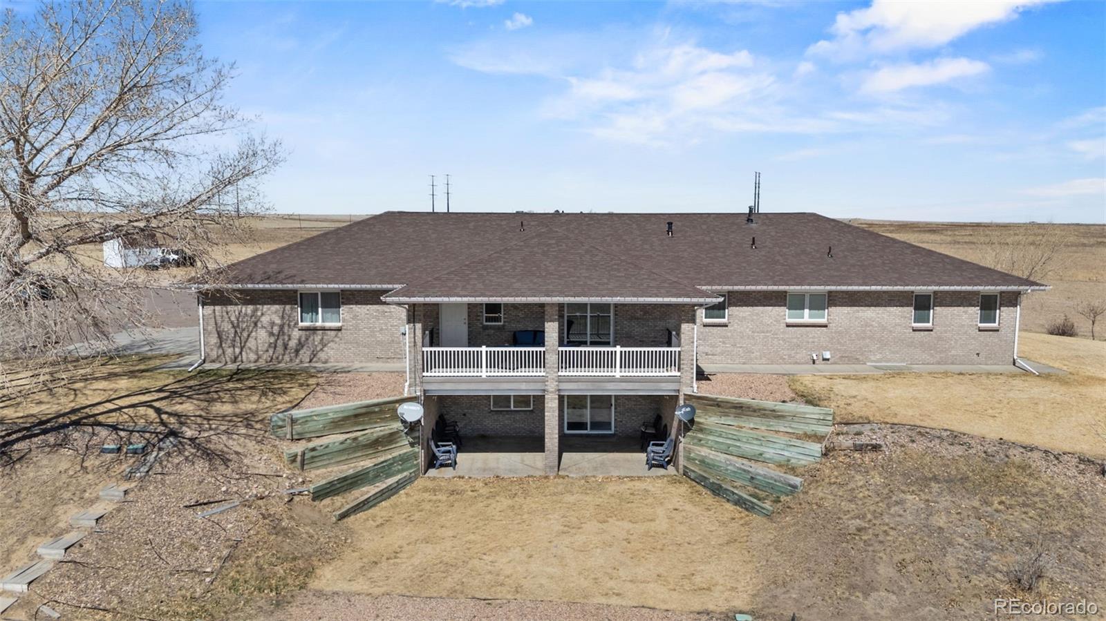 5330 Kiowa-Bennett Road Bennett, CO 80102 - Photo 44 of 50 a front view of a house with a yard