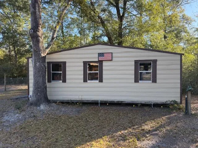 a view of a back yard of the house