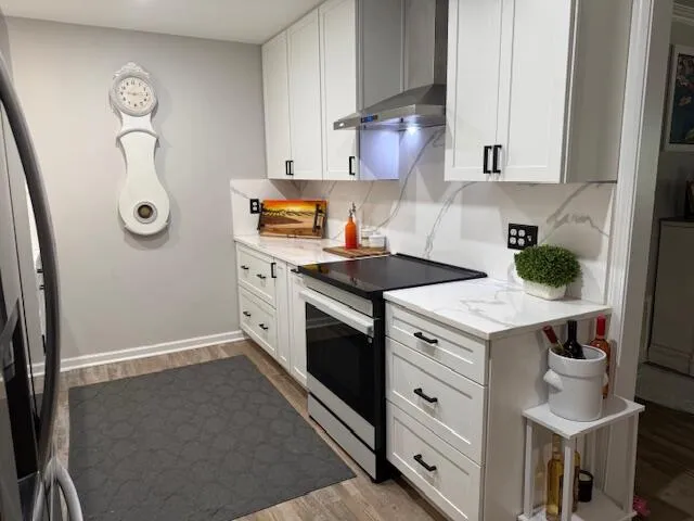 a kitchen with a stove and a refrigerator