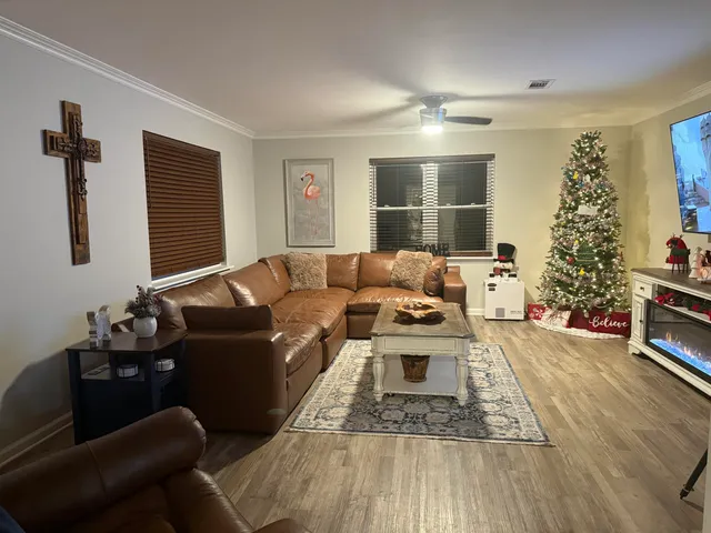 a living room with furniture and a rug