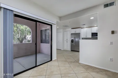 a view of a kitchen with an empty space and a window