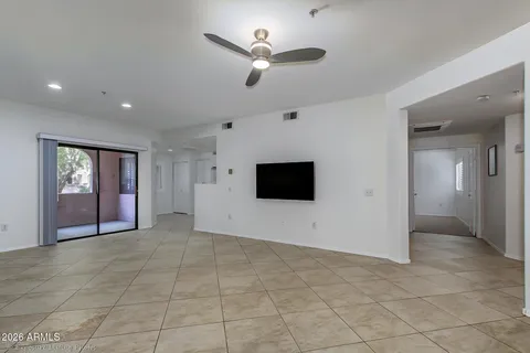 a view of an empty room with a flat screen tv