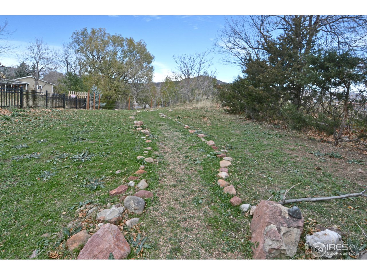 1590 Hillside Road Boulder, CO 80302 - Photo 17 of 25 a backyard of a house with lots of green space