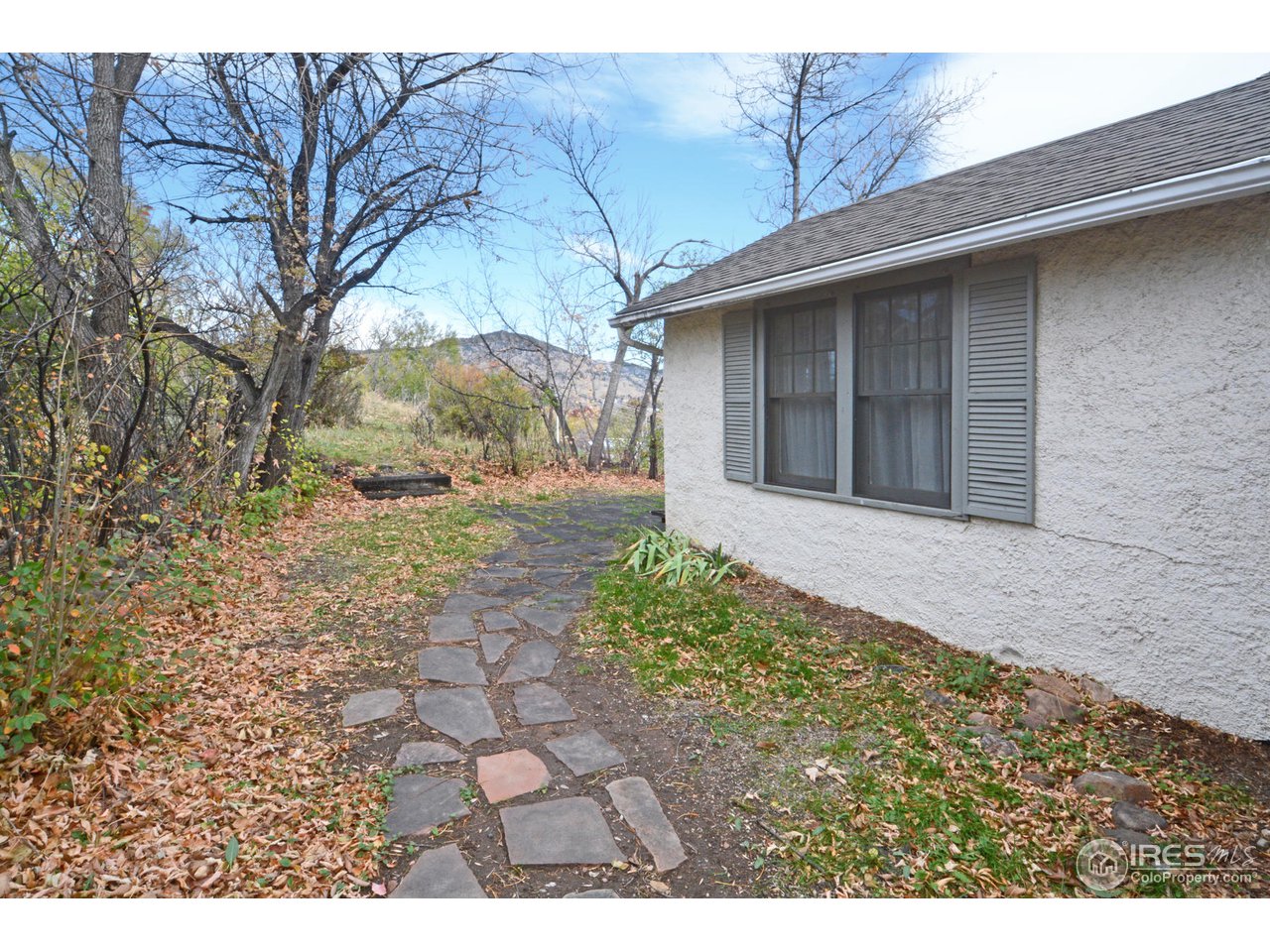 1590 Hillside Road Boulder, CO 80302 - Photo 5 of 25 a front view of a house with garden