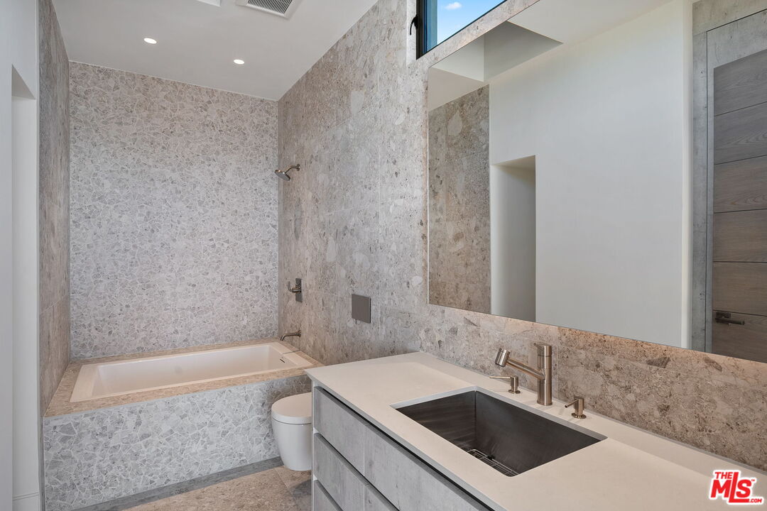 938-940 Palisades Beach Road Santa Monica, CA 90403 - Photo 39 of 72 a bathroom with a sink a toilet and shower