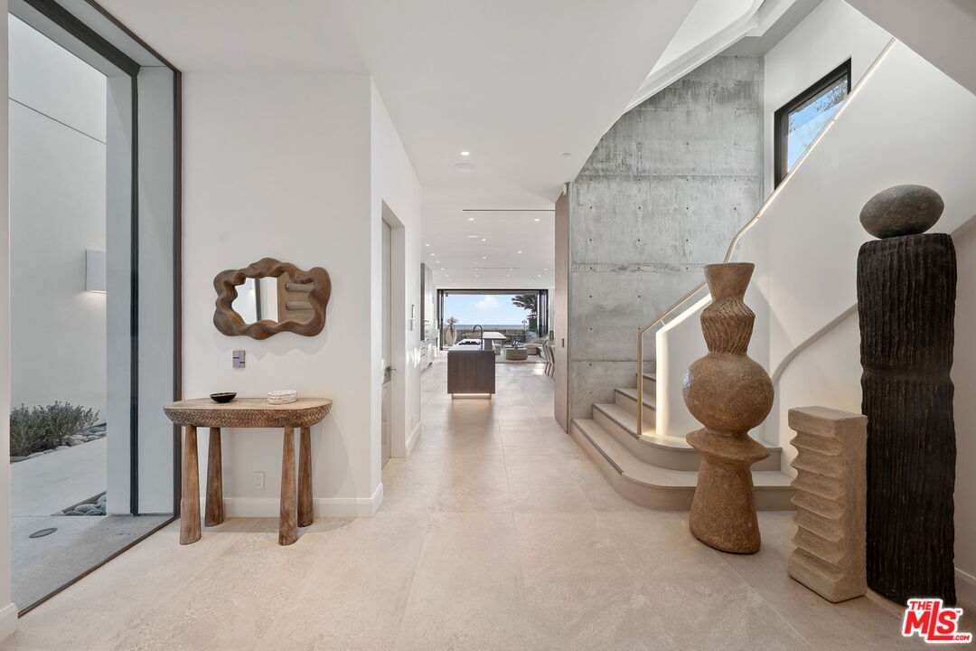 938-940 Palisades Beach Road Santa Monica, CA 90403 - Photo 52 of 72 a living room with furniture and a mirror