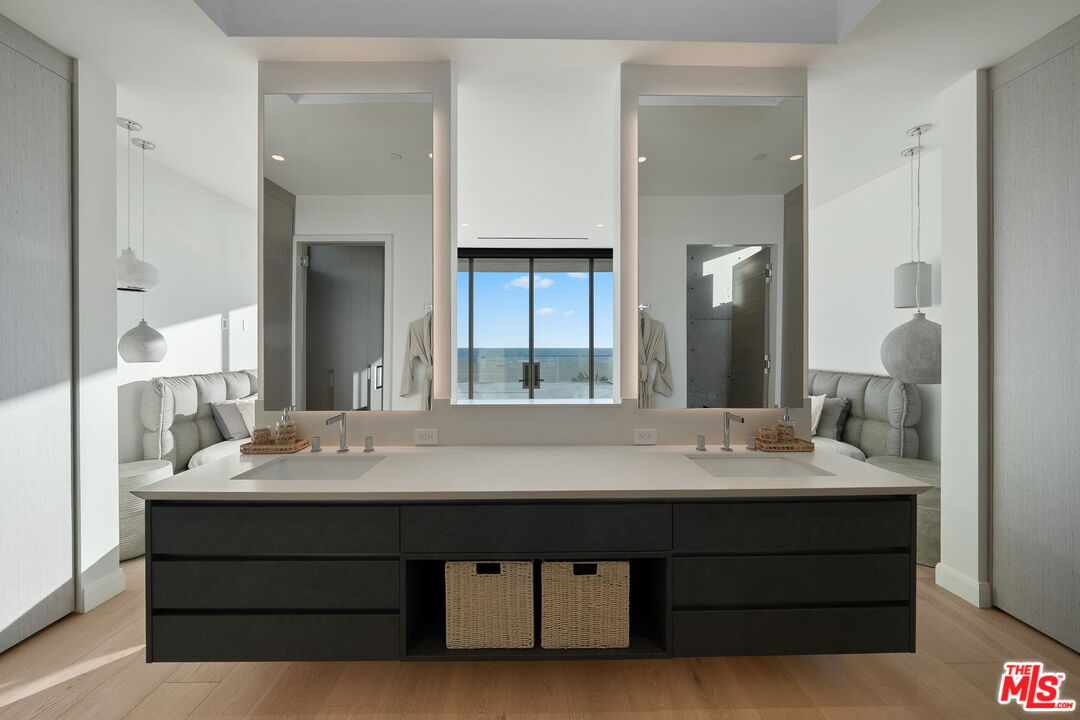 938-940 Palisades Beach Road Santa Monica, CA 90403 - Photo 68 of 72 a bathroom with a sink and a mirror