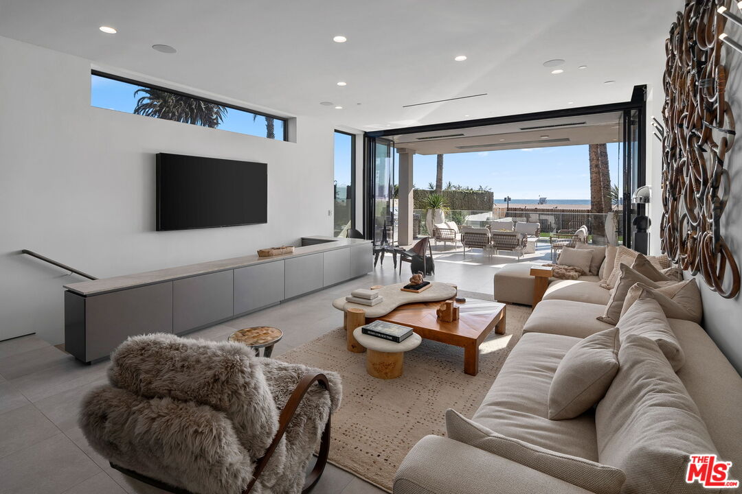 938-940 Palisades Beach Road Santa Monica, CA 90403 - Photo 10 of 72 a living room with furniture and a flat screen tv