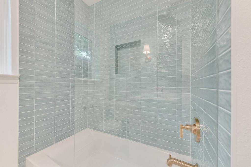 13427 Purple Sage Road Dallas, TX 75240 - Photo 17 of 31 a bathroom with a shower