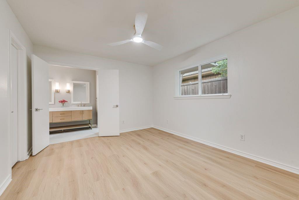 13427 Purple Sage Road Dallas, TX 75240 - Photo 19 of 31 A bright, airy space with easy access to the ensuite bath creates a true primary retreat.