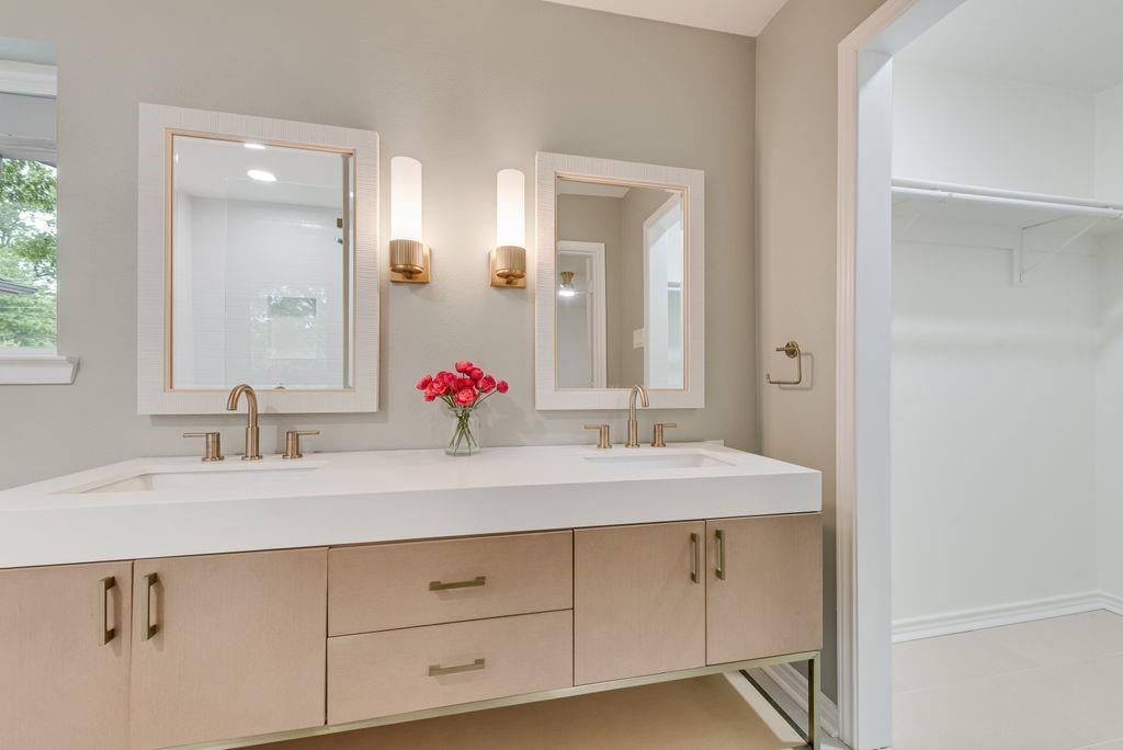 13427 Purple Sage Road Dallas, TX 75240 - Photo 20 of 31 a bathroom with a sink and a mirror