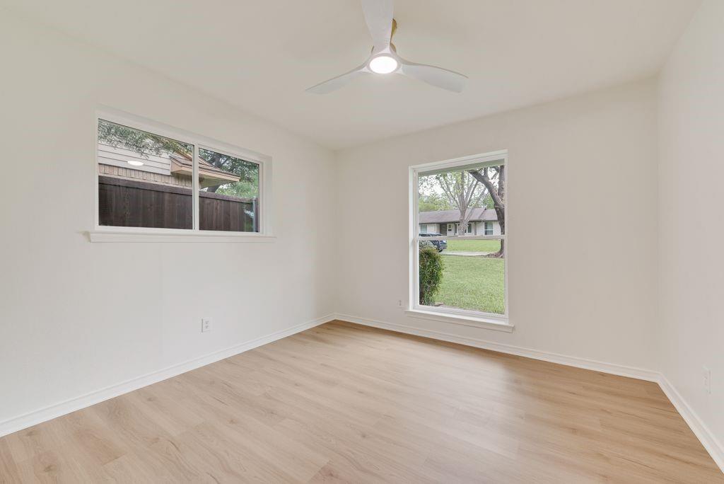 13427 Purple Sage Road Dallas, TX 75240 - Photo 23 of 31 Multiple windows bring in natural light, giving this room a bright and open feel.