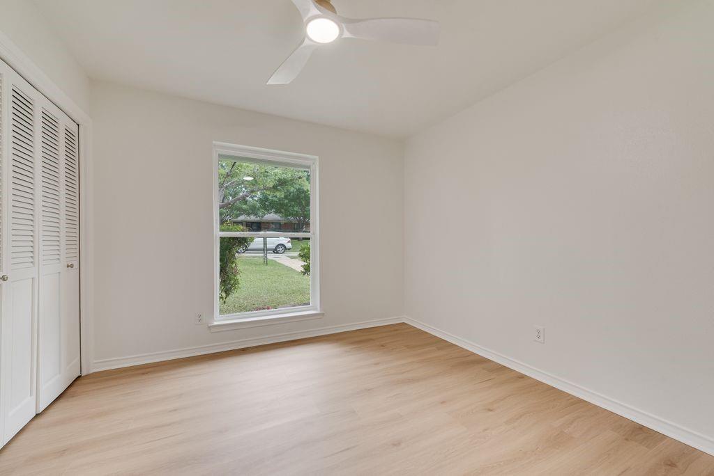 13427 Purple Sage Road Dallas, TX 75240 - Photo 24 of 31 Neutral finishes and natural light make this bedroom feel bright and versatile.