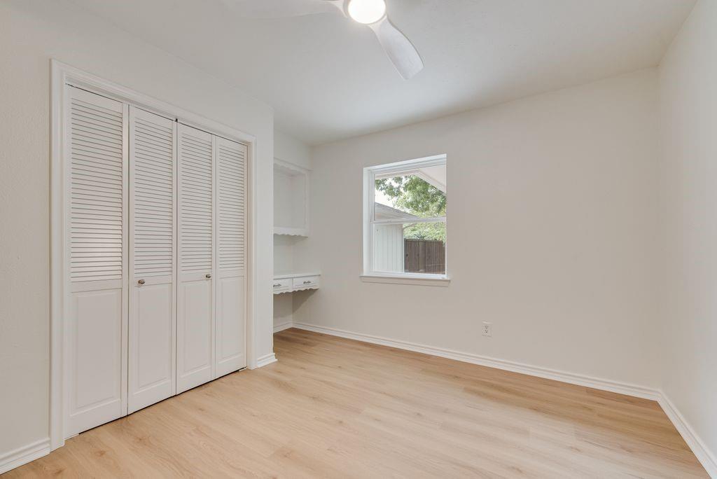 13427 Purple Sage Road Dallas, TX 75240 - Photo 25 of 31 Clean lines and a functional layout offer flexibility for guests or workspace with the built-in desk.