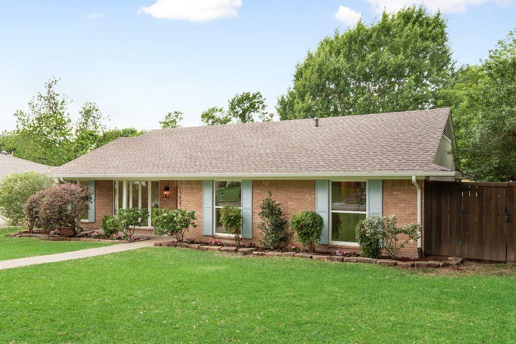 13427 Purple Sage Road Dallas, TX 75240 - Photo 31 of 31 a front view of house with yard and green space