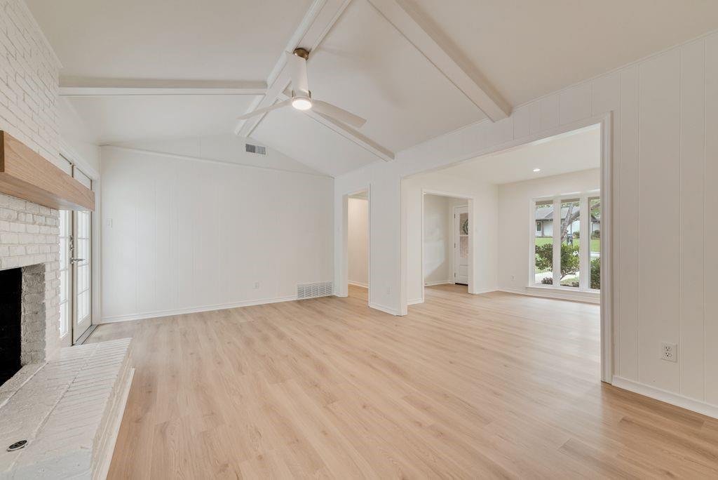 13427 Purple Sage Road Dallas, TX 75240 - Photo 7 of 31 Vaulted ceilings and open space make this room feel both expansive and comfortable for entertaining.