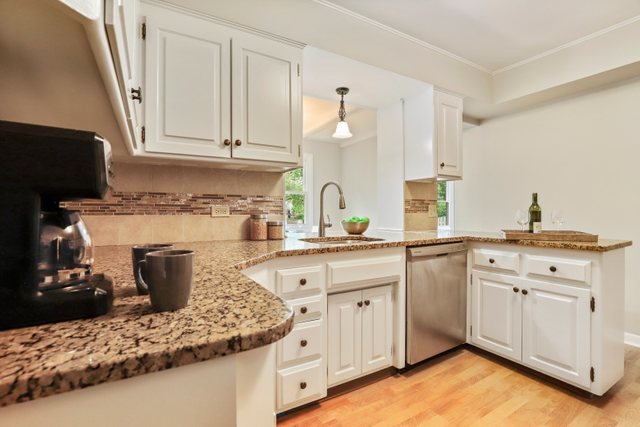 309 East Avenue Park Ridge, IL 60068 - Photo 11 of 32 a kitchen with a sink stove and cabinets