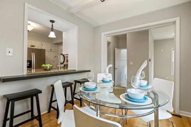 309 East Avenue Park Ridge, IL 60068 - Photo 12 of 32 a dining room with furniture and wooden floor