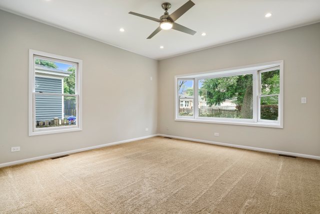 309 East Avenue Park Ridge, IL 60068 - Photo 14 of 32 an empty room with a window and a ceiling fan