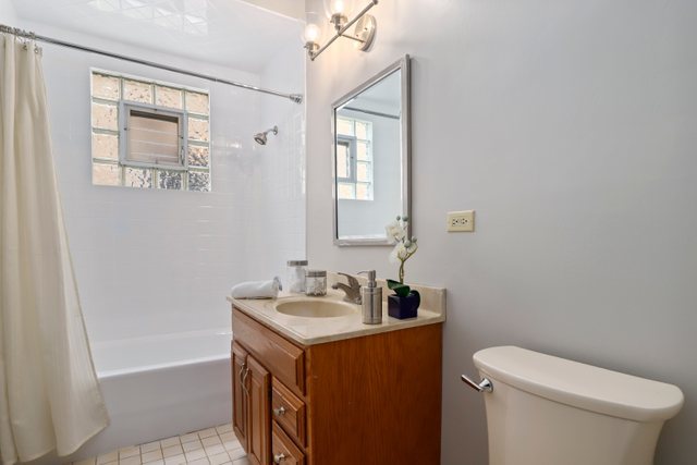 309 East Avenue Park Ridge, IL 60068 - Photo 16 of 32 a bathroom with a sink a toilet and shower