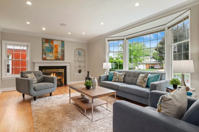 309 East Avenue Park Ridge, IL 60068 - Photo 2 of 32 a living room with furniture a large window and a fireplace