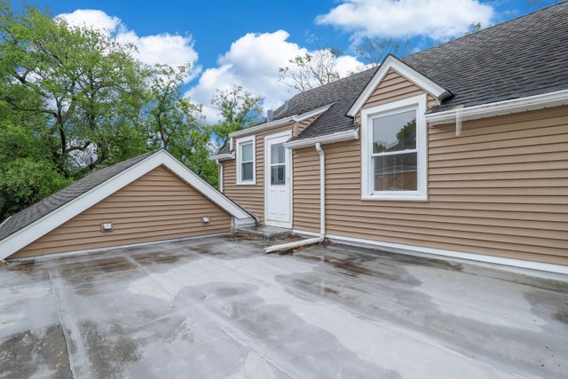 309 East Avenue Park Ridge, IL 60068 - Photo 26 of 32 a view of house with backyard and trees in the background
