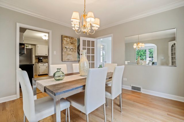 309 East Avenue Park Ridge, IL 60068 - Photo 6 of 32 a view of a dining room with furniture wooden floor and chandelier