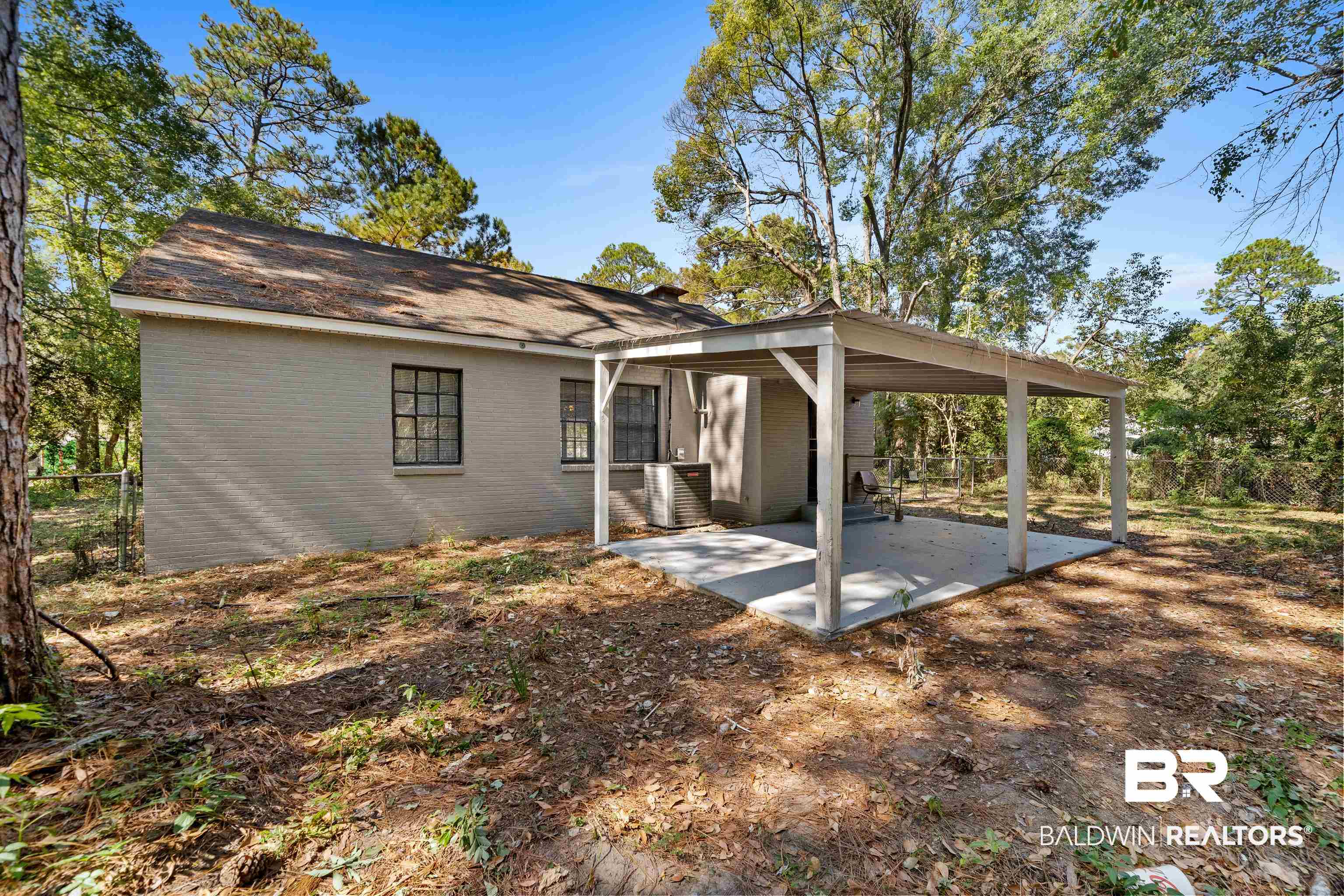 611 Morgan Avenue Mobile, AL 36606 - Photo 24 of 24 Rear view of property with a patio and central air condition unit