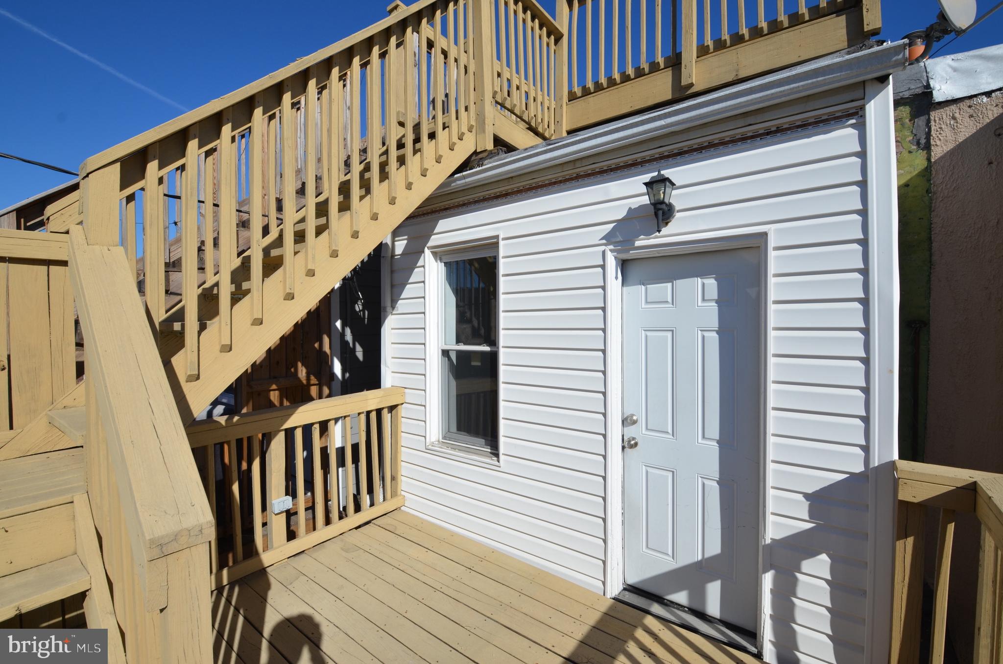 26 North E Avenue Baltimore, MD 21224 - Photo 17 of 22 a view of entryway with wooden floor