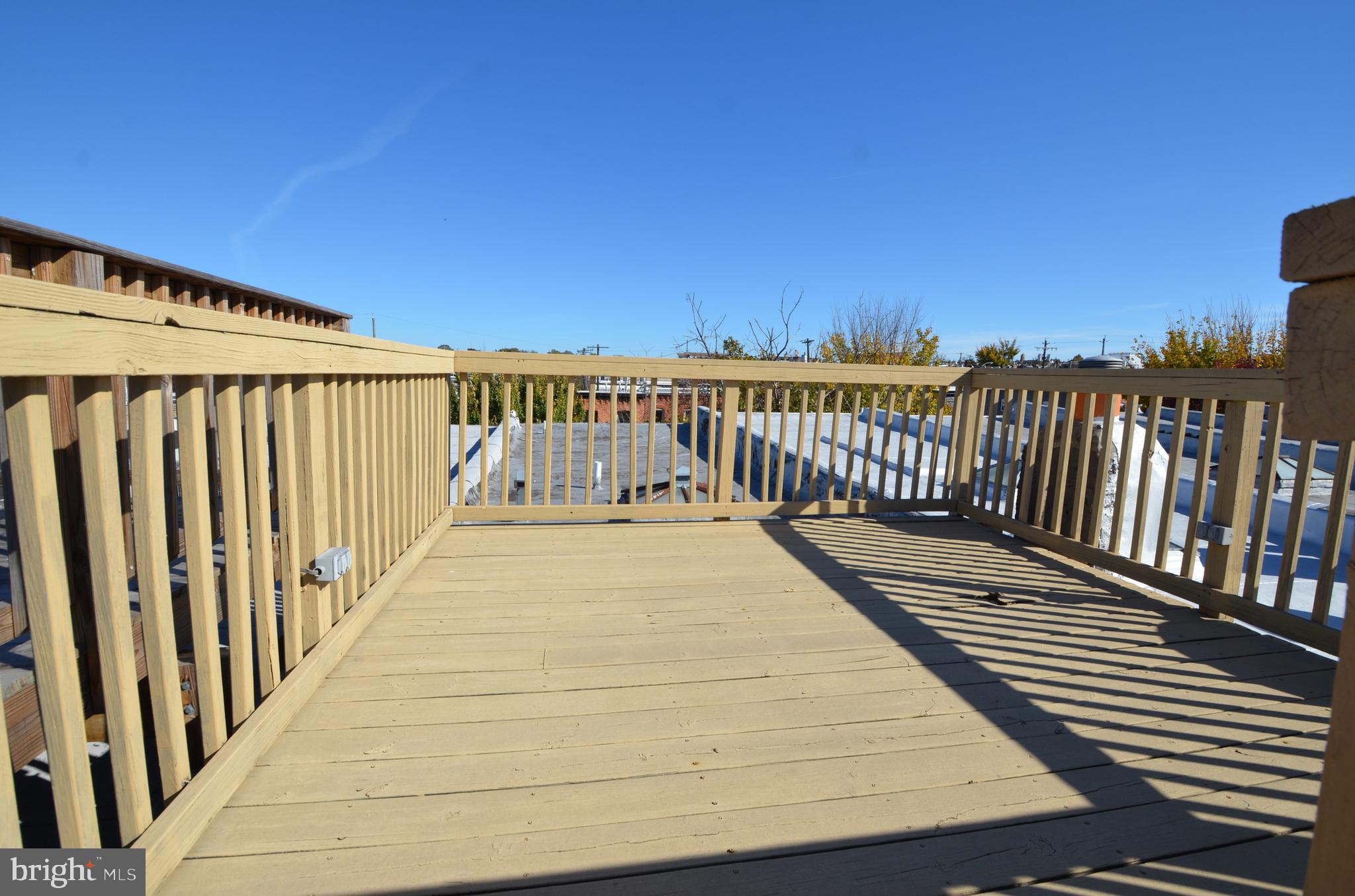 26 North E Avenue Baltimore, MD 21224 - Photo 19 of 22 a view of wooden balcony with wooden floor and fence